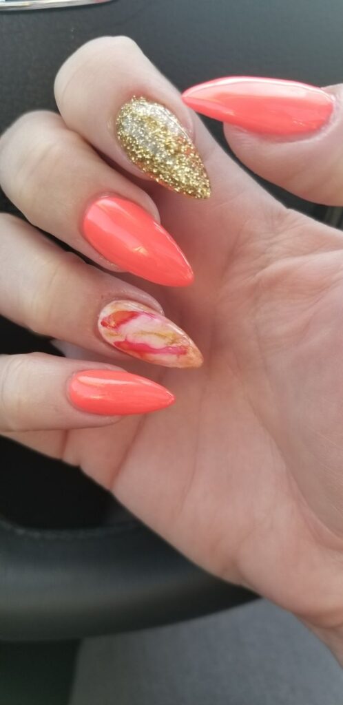 Bright Coral Nails with Gold Foil Accents